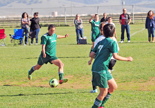 Down 2-0 at the half in their final tournament game of 2014, team captain Karina Briseño of the U-17 Real Salinas Thundergirls helps her side roar back to tie the game and retain first place.