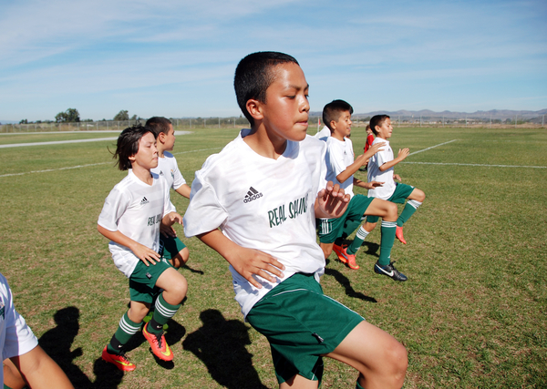 For members of Real Salinas United, the boy’s U-12 team, conditioning is everything for this warmup session at Bolsa Knolls Middle School in Salinas before one of their final tournament games for 2014.