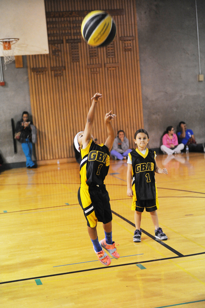 Taking a jump shot like a pro with a full-size ball, this young player will develop fast.