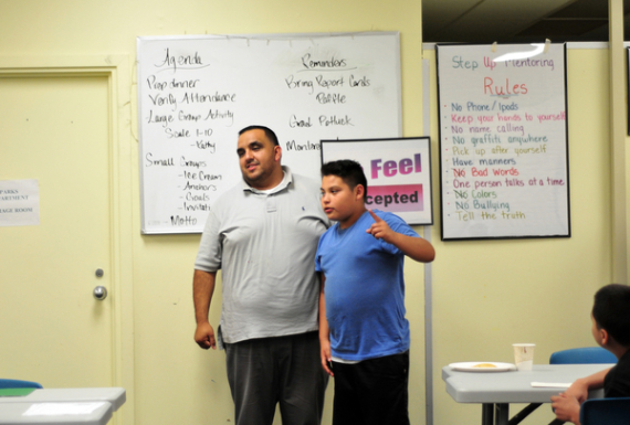 Mentor Leo Jimenez and Manny Morfin participate in a confidence exercise at the Silver Star Resource Center in Salinas.